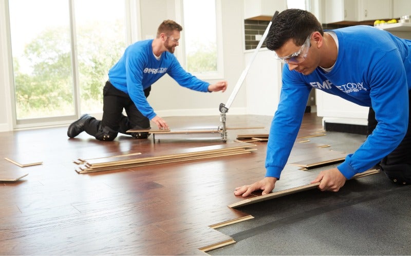 Empire flooring experts installing new floors in a home